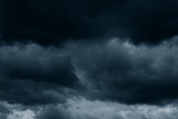 Stormy rain big fluffy clouds. Dark sky. Natural scenic abstract background. Weather changes backdrop. Sky filled with voluminous clouds.