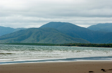 Four mile beach at Port Douglas with heavy storm clouds on the sky