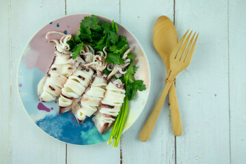 Steamed squids or Octopus on dish.