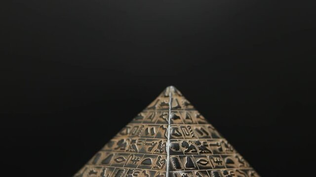 pyramid of stone on black background