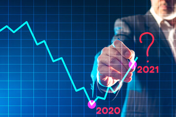 Graph symbolizes the unknown. Question is next to number 2021. Man draws a graph on glass. Lack of...