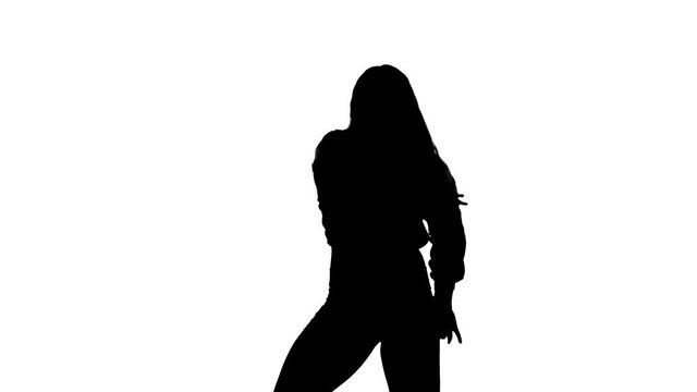 Medium long shot of young sensual beautiful woman dancer with long hair dancing dancehall, hip hop, street modern dance. Slow motion. Contemporary choreography. Black silhouette on a white background