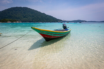 Fototapeta na wymiar Beautiful tropical beach with white sand and turquoise water on Perhentian Island, Malaysia