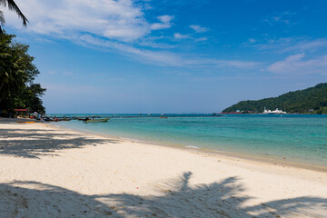 Beautiful tropical beach with white sand and turquoise water on Perhentian Island, Malaysia