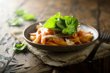 Pasta with tomato sauce and fresh spinach