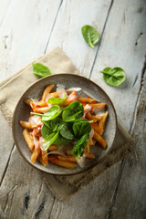 Pasta with tomato sauce and fresh spinach