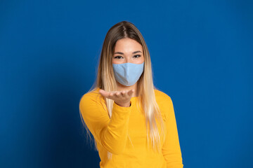 Blonde girl wearing a face mask