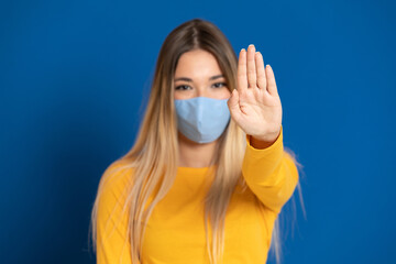 Blonde girl wearing a face mask