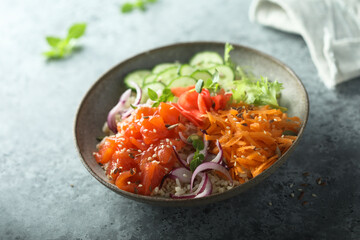 Healthy salmon poke bowl with quinoa