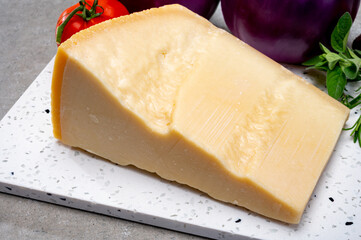 Ingredients for Italian dish made from fresh eggplant, parmesan cheese and tomatoes Melanzane alla parmigiana