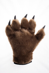 Brown bear paws on white background, big claws furry monster toy gloves