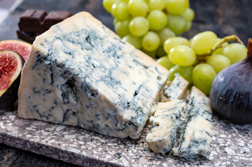 Cheese collection, piece of italian blue cheese gorgonzola picante with blue mold from north of Italy