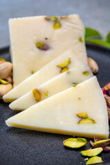 Cheese collection, fresh Italian pecorino cheese made from sheep milk filled with pistachio nuts...