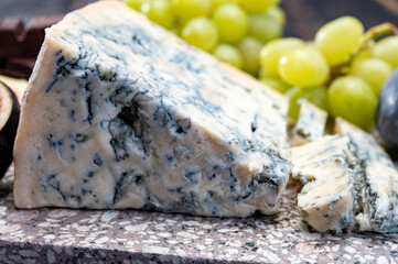 Cheese collection, piece of italian blue cheese gorgonzola picante with blue mold from north of Italy