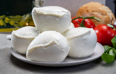 Fresh handmade soft Italian cheese from Campania, white balls of buffalo mozzarella cheese made from cow milk ready to eat