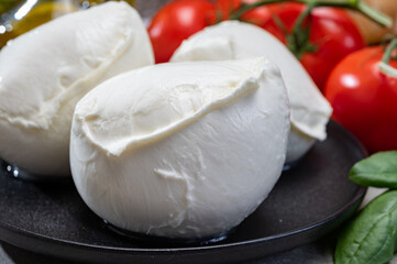 Fresh handmade soft Italian cheese from Campania, white balls of buffalo mozzarella cheese made from cow milk ready to eat