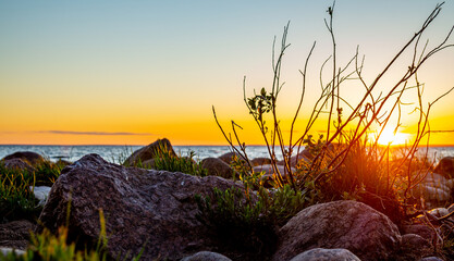 Sunset on the rocky beach.