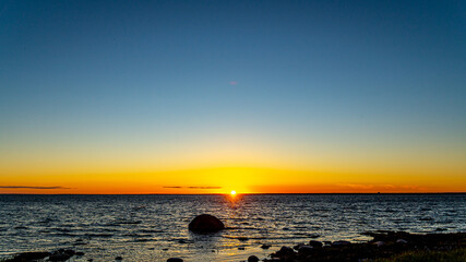 Sunset on the rocky beach.