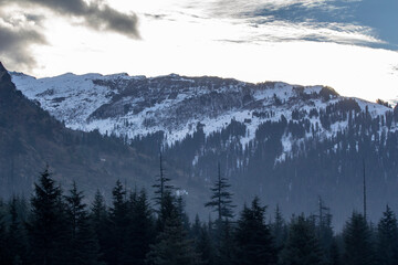 Landscape of mountain range covered with snow in Manali during summers. Mountain peak in snow.