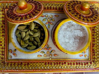 Traditional Handmade Kundan Tray and Bowl containing cardamom and misri (rock sugar) as a mouth freshner. 