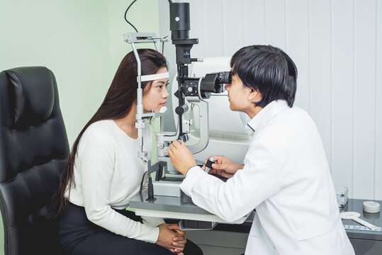 Consultation with an ophthalmologist. Young asian woman and doctor 