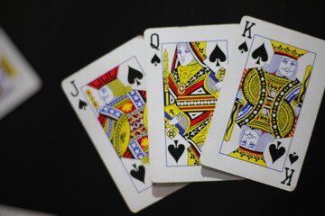 playing cards on a black
