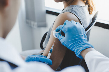 Vaccination of patients, Doctor provided a vaccine with a syringe against a new strain of  virus or influenza in a modern hospital, Prevention and health care concept. - obrazy, fototapety, plakaty