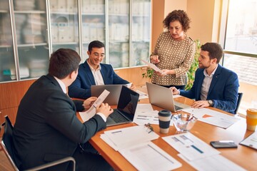 Obraz premium Business lawyers workers meeting at law firm office. Professional executive partners working on finance strategry at the workplace