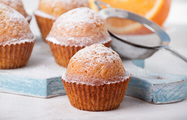 Orange muffins with icing sugar