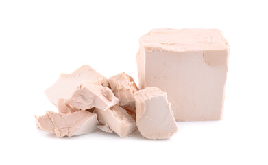 Fresh pressed yeast, isolated on white background. Compressed fresh yeast block.