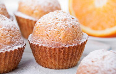 Orange muffins with icing sugar