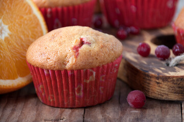 Orange muffins with cranberries close-up