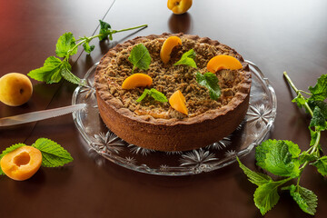 Cheesecake with fresh apricot for dessert - healthy organic summer berry dessert cheesecake and coffee, copy space, top view. Homemade cheese cake.
