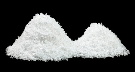 Piles of white snow isolated on a black background. Snowdrifts. Snow hills.