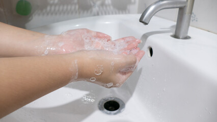 Closeup woman's hand washing - 354065629