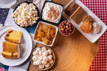 June party. Typical sweets from festa junina. Cornmeal cake, popcorn, hominy, paçoca, cocada, pumpkin jam, and peanuts