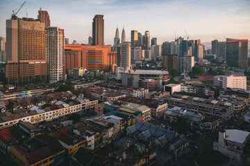 The center of Kuala Lumpur. On the horizon is a recognizable skyline of the city, visible Petronas...