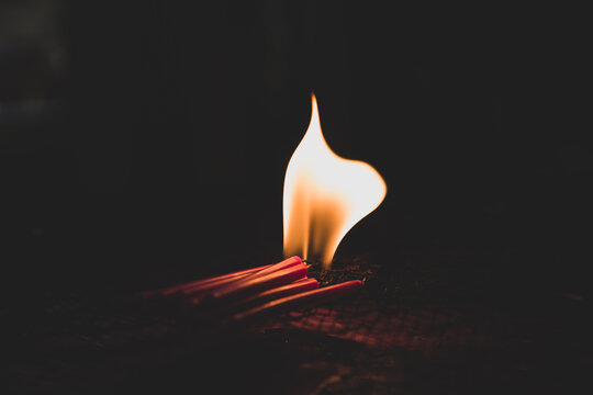 Candle lights in the darkness. Abstract candles background. Hope, fire.