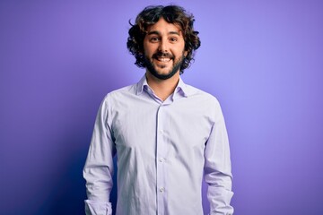 Fototapeta na wymiar Young handsome business man with beard wearing shirt standing over purple background with a happy and cool smile on face. Lucky person.