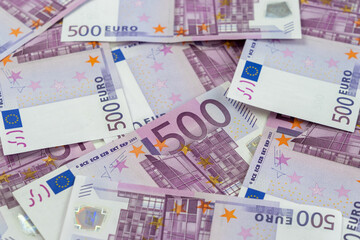 Banknotes of five hundred and 500 euros are scattered in a chaotic manner. European currency blank for design, background. Side view.