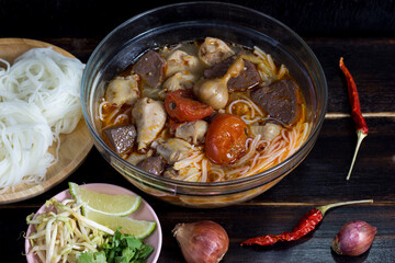 Famous food in the north of Thailand Delicious rice noodles with curry juice