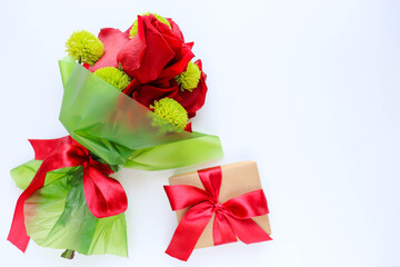 greeting card design. small bouquet of red roses on a white background. congratulation. invitation