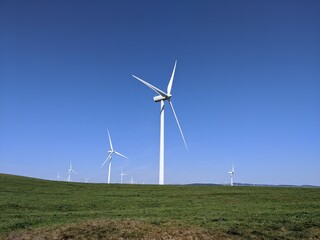 wind turbines in a wind farm with a mountain landscape