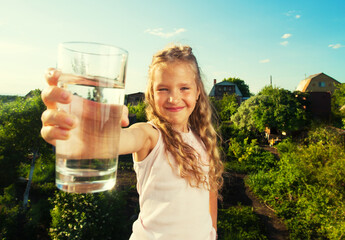 Child holding glass water