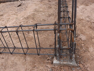 The steel structure of the foundation of the house has not been poured in concrete.