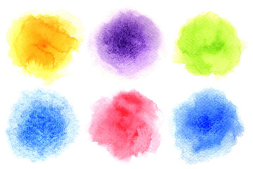 Six colors watercolor painted in circle shape on a white rough watercolor paper and isolated on white background.