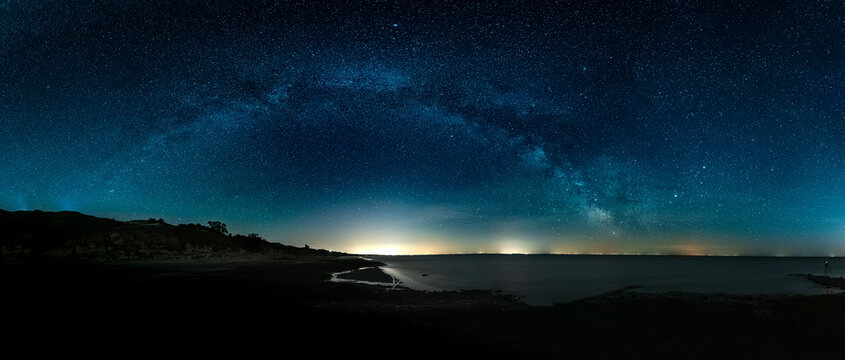 Amazing Panoramic HDR Landscape view of Milky way over Night sky © Michael Cola