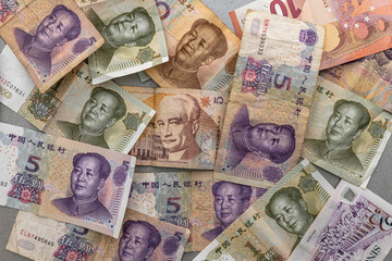 many different banknotes dollar euro yuan background