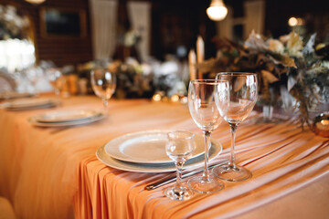 Festive table setting with empty wine glasses