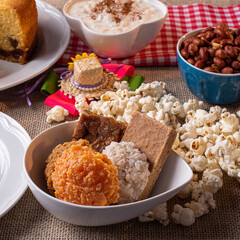 June party. Typical sweets from festa junina. Cornmeal cake, popcorn, hominy, paçoca, cocada, pumpkin jam, and peanuts